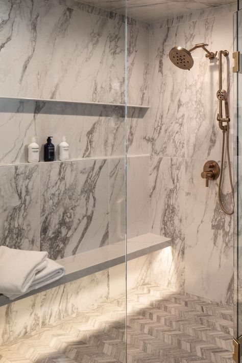 Elevate your daily routine with the epitome of luxury: a marble-encased shower adorned with opulent gold fixtures and an underlit shower bench. ✨ Immerse yourself in sophistication as you step into this lavish oasis, where every detail exudes elegance and refinement. Let the soft glow from the underlit bench envelop you in warmth as you indulge in a moment of pure relaxation. Experience the pinnacle of indulgence in your own home spa retreat. #LuxuryBathroom #MarbleShower #GoldFixtures Luxury Shower With Bench, Marble Shower Gold Fixtures, Bench In Shower Ideas, Shower Bench Ideas Built Ins, Stone Shower Bench, Steam Showers Bathroom Master Bath, Shower Bench Ideas, Shower Marble, White Marble Shower