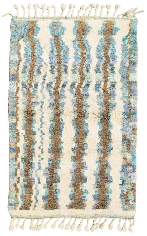 This rug features an inspired design from the Azilal style, with stunning shades of blue that radiate depth and strength. Handmade from 100% wool, this rug is thick and durable. Free shipping is available worldwide, and each rug is made to order with a 5-6 week lead time. Rugs are shipped directly from Morocco via DHL Express and typically take 7-14 days in transit. We are also happy to work with you on small customizations to color or dimensions to make it truly unique to your space.