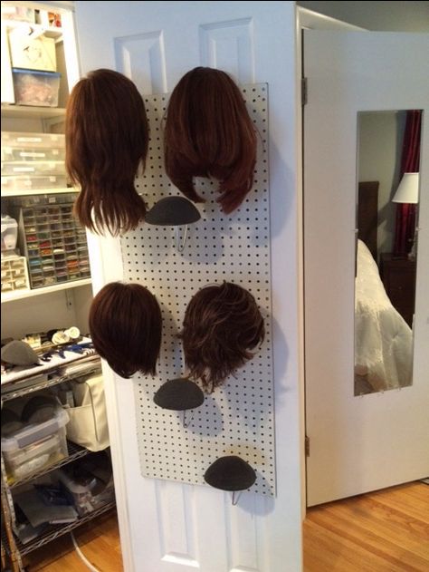 My current wig storage solution that I built on the inside door of my craft closet! Wig Storage Ideas Closet, Wig Storage Ideas, Wig Organizer, Wigs Storage Ideas, Costume Organization, Hair Storage, Wig Boutique, Wig Storage, Hair Product Storage