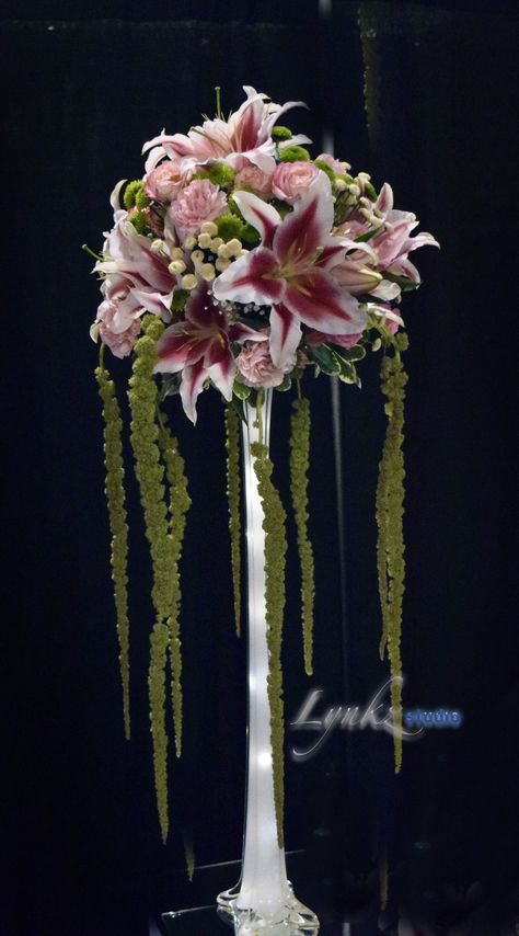 Centerpieces Tall Vase, Eiffel Vase Centerpiece Ideas, Lily Wedding Centerpieces, Stargazer Lily Wedding, Tall Vase Arrangements, Altar Flowers Wedding, Computer Storage Devices, Eiffel Tower Centerpiece, Lily Centerpieces