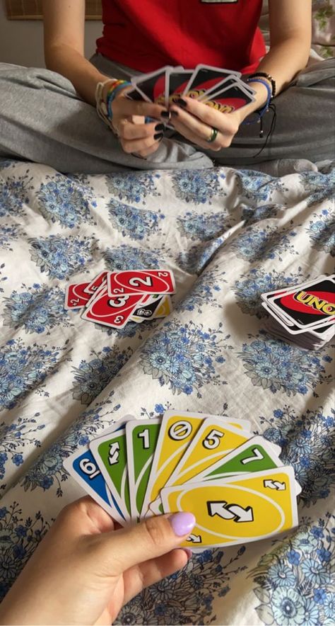 A fun game of Uno at a party with friends Arya Aesthetic, Couple Playing Cards, Casual Date Ideas, Alphabet Date Ideas, Hotel At Night, The Ultimate Sleepover, Alphabet Dating, Play Uno, Uno Card