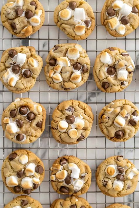 These marshmallow chocolate chip cookies are a fun twist on a childhood classic! Soft, chewy, studded with chocolate chips, and loaded with gooey marshmallows, they're just waiting for you to take a bite. Chocolate Chip With Marshmallow Cookies, Chocolate Chip Cookies Marshmallow, Chocolate Chip Cookie With Marshmallow, Chocolate Chip Cookies With Marshmallows Recipe, Marshmellow Treats Christmas, Chocolate And Marshmallow Cookies, S’mores Cookies Easy, Marshmallow Cookies Easy, Marshmallow Baking Ideas