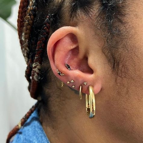 Marilyn Mena-Scott - Ear Stylist on Instagram: "Please keep the yellow gold and green requests coming! All my Loki ear dreams are coming true. We did a green tourmaline and yellow gold pairing for Desiree and I am completely obsessed. We turned her super low third lobe piercing into a ltriple and I love that we could repurpose that area of insecurity for her. Now if anyone wants to get a ruby and citrine setup I AM HERE FOR IT!! Ironman ears. I hope it catches on!" Third Lobe Piercing, Double Lobe Piercing, Lobe Piercing, Green Tourmaline, Citrine, Tourmaline, Ear Cuff, Piercings, Hoop Earrings