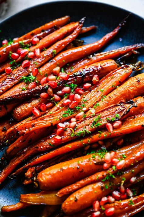 These Brown Sugar Honey Glazed Carrots are roasted to crispy, caramelized perfection, with fresh parsley, thyme and a pinch of cinnamon for fall flavor. An easy, delicious holiday side dish that everyone will enjoy. Honey Ginger Glazed Carrots, Roasted Caramelized Carrots, Roasted Carrots For Christmas, Thanksgiving Side Carrots, Christmas Roasted Carrots, Christmas Carrots Recipe, Christmas Side Dishes Carrots, Honey Glazed Parsnips And Carrots, Christmas Dishes Ideas