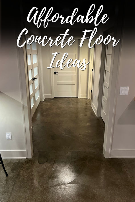 A hallway with dark stained concrete floors, white doors, and neutral-colored walls, with the text "Affordable Concrete Floor Ideas" overlaid on the image. The polished concrete floor adds a modern and sleek look to the space. Cheapest Flooring Ideas, Concrete Stain Colors Indoor, Stained Concrete Floors Farmhouse, Inexpensive Flooring Ideas, Indoor Concrete Floor Ideas, Concrete Living Room Floors, Stained Cement Floors, Concrete Floor Ideas, Diy Stained Concrete Floors