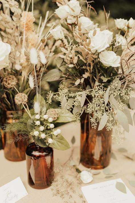 Black Taupe And Greenery Wedding, Boho Neutral Centerpieces, Simple Boho Bridal Shower Centerpieces, Jug Centerpiece Wedding, Norse Wedding Decor, Simple Boho Wedding Centerpieces, Amber Vases Wedding Centerpieces, Dried Flowers Wedding Centerpieces, Boho Wedding Centerpieces Diy