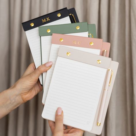 Designed to be practical, re-usable & stylish! With perforation pages and a magnetic attachment to hold your matching pen, this set is guaranteed to be eye-catching on any workspace. Plus add personalisation to make it your own. Product Details: - Size: 151x185mm | Notepad Size: 127x155mm Paper Details: 80 x 100gsm ivory lined sheets with perforation Also includes: Matching Ballpoint Pen and magnetic attachment to keep it secure To refill: Simply unscrew the gold hardware on the faux-leather cas Photo Album Organization, Custom Notepads, Cool Office Supplies, Author Gifts, Magnetic Pen, Pen Set Gift, Free Tote, Personalised Pens, Planner Binder