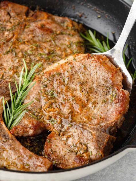 Craving an easy dinner that's ready in 30 minutes? These Oven Baked Bone-In Pork Chops are just what you need! With a savory garlic-rosemary butter, this dish is packed with flavor and perfect for busy weeknights. Bake Bone In Pork Chops In Oven, Pork Chops In Oven Recipes, Best Baked Pork Chops Bone In, Tender Baked Pork Chops Bone In, Thick Pork Chops In Oven, Baked Pork Chops Oven Bone In, Healthy Baked Pork Chops Oven Bone In, Bone In Pork Chop Recipe In Oven, Baked Bone In Pork Chops