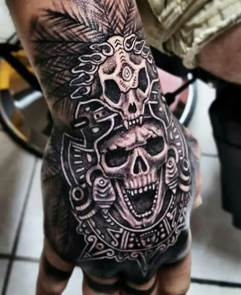 Are you looking for an original and impressive tattoo? Then Aztec tattoo design is right for you. It provides large-scale and profound meaning to feel solid and confident. Also, we will provide excellent tattoo designs for your inspiration. Aztec Hand Tattoos For Guys, Mayan Hand Tattoo, Mexico Tattoo Ideas Mexican Art, Aztec Hand Tattoo, Mexican Tattoo Ideas For Men Aztec, Best Neck Tattoos Men Design, Aztec Warrior Tattoo Men, Aztec Tattoo Designs For Men, Aztec Skull Tattoo