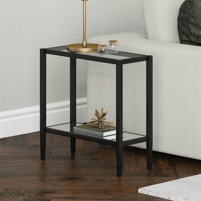 This contemporary side table is the perfect pick for your living room or den ensemble. The tabletop features transparent tempered glass perfect for placing a table lamp, remotes, or your favorite books. The lower mirrored glass shelf plays off the tempered glass top and is perfect for showcasing decorative items. Its understated silhouette and neutral metallic finish allow it to blend in with your existing decor style or color scheme. Table Base Color: Blackened Bronze | Latitude Run® Nicasio An Side Table With Glass, Rectangular Side Table, Contemporary Side Table, Bronze Side Table, Mirrored End Table, Glass Top End Tables, Contemporary Side Tables, Glass End Tables, Arched Floor Lamp