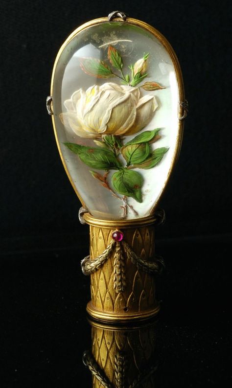 Parasol handle with a reverse intaglio depicting a rose motif. A reverse crystal intaglio is a rock crystal cabochon with an intaglio carved into the flat back 1860-1900 Bijoux Art Nouveau, Canes And Walking Sticks, Cane Handles, Red Carnation, Walking Sticks And Canes, Hiking Sticks, Canes & Walking Sticks, Umbrellas Parasols, Walking Canes