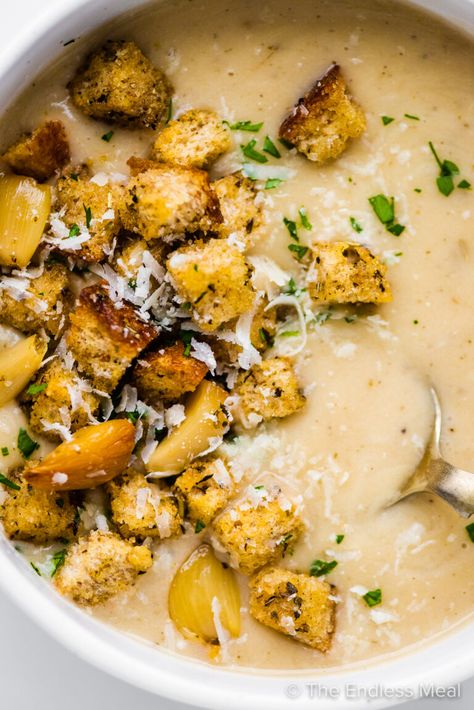 This wonderfully creamy roasted garlic soup is full of the deliciously mellow umami flavor of slow-roasted garlic. It's a surprisingly simple recipe that you'll want to make all soup season long! #theendlessmeal #garlicsoup #roastedgarlicsoup #40garlicclovesoup #40garlicsoup #40clovegarlicsoup #soup #garlic #souprecipe #garlicrecipes #roastedgarlic Garlic Soup Recipe, Roasted Garlic Soup, Lemon Soup, Cream Of Broccoli Soup, Comfort Soup Recipes, Beef Barley Soup, Garlic Soup, Loaded Baked Potato Soup, Comfort Soup