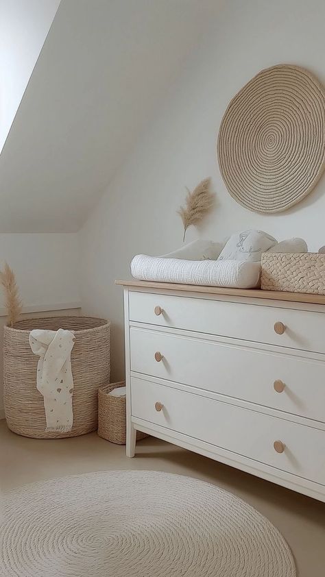 Minimalist neutral nursery with a wooden dresser, woven decor, and soft beige tones. Pastel Baby Nursery, White Ant, Neutral Nurseries, Baby Nursery Closet, Calm Space, Minimalist Pastel, Natural Nursery, Wood Nursery, Nursery Closet