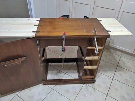 I came across a 1959 sewing cabinet (minus the machine) online for $15.So I picked it up and gave it a makeover, to be used as extra storage and surface space.   The veneer on the cabinet top was damaged. And when you opened up/folded back the top, there was a big hole, where the sewing machine sat originally.     So the first thing I did was go to Home Depot and buy pine wood and have them cut it to the exact same sizes as the two original fold out pieces.   Then I remo… Sewing Cabinet Makeover, Old Sewing Cabinet, Sewing Table Repurpose, Go To Home, Sewing Machine Cabinet, Cabinet Top, Sewing Machine Table, Update Cabinets, Sewing Cabinet