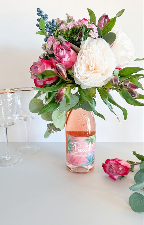 Flower Arrangements For Bridal Shower Tables, Flower Gift Ideas Diy, Champagne With Flowers, Flower Champagne Gift, Flowers On Champagne Bottle, Wine Party Centerpiece Ideas, Flowers On A Wine Bottle, Flower Bouquet On Wine Bottle, Wine Bottle Flower Centerpiece