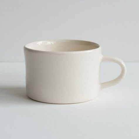 Wrap your hands around this beautifully stylish  Cream Plain Wash Mug  from  Musango . Ideal for those who like their cups of tea and coffee to be generous in size, this ceramic mug is hand-painted and hand-finished by artisan craftspeople in Portugal.   Its size lends itself to being used too as a small bowl for soups, porridge or helpings of dessert.    Cream Plain Wash Mug   Dimensions: 10cm diameter x 6.5cm height   Ceramic   Hand-finished and hand-painted   Handmade in Portugal   Each piece is unique so colour may vary from image shown   Microwave & dishwasher safe Classy Mugs, Cream Plain, Minimalist Mug, Coffee House Design, Plain Mugs, Cream Mugs, Be Generous, Cups Of Tea, Clay Cup