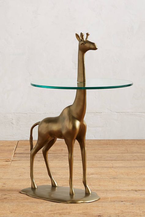 @lszwaj   if we ever end up living together when we are old.  I"m requesting this be our side table.  Anthropologie Giraffe Side Table Ancient Furniture, Mud Houses, Quirky Homeware, Africa House, Teapot Lamp, Quirky Furniture, Service Table, Pvc Pipe Crafts, Glass Top Side Table