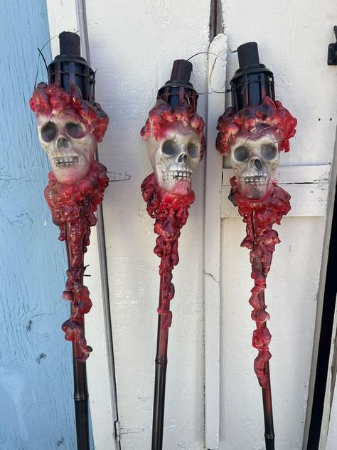 HALLOWEEN GRAVEYARDS, DISPLAYS AND HAUNTS | Quick and easy tiki torches using dollar store skulls. | Facebook Halloween Graveyard, Tiki Torches, Halloween Craft, Halloween 2024, Halloween Projects, Graveyard, Dollar Tree, Halloween Crafts, Dollar Stores