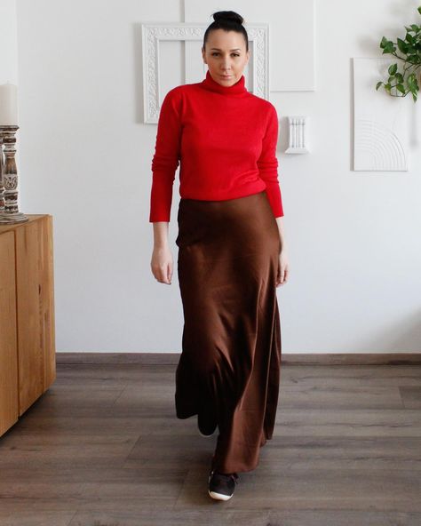 Elegance meets casual chic in this combo! 💫 Pairing a chocolate brown maxi satin skirt with a vibrant red turtleneck adds a pop of color, while classic Adidas Samba sneakers keep it effortlessly cool. Perfect for a day out or a casual evening look! #maxiskirt #casualchic #fashionover30 #chicstyle #elegantwomen #timelessfashion #modernclassic #feminineelegance #sophisticatedlook #fabulousat40 Maxi Satin Skirt, Samba Sneakers, Classic Adidas, Red Turtleneck, Casual Evening, Satin Skirt, Adidas Samba Sneakers, Adidas Samba, Vibrant Red