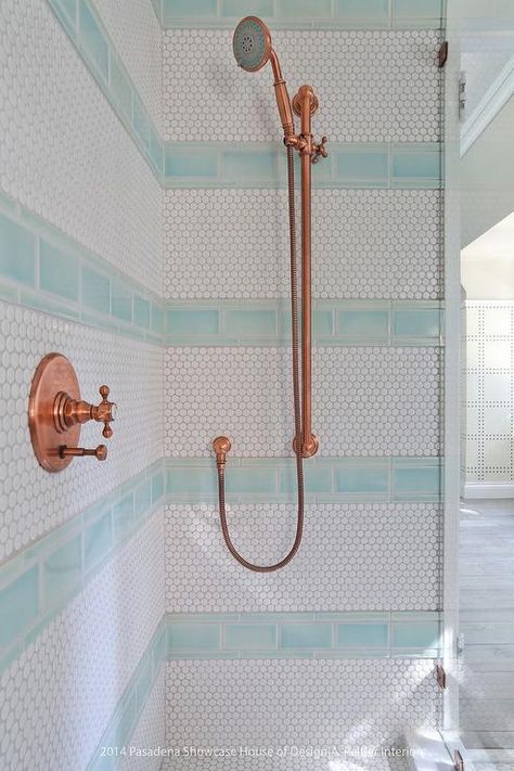 Blue and white kid's walk-in shower features an eye-catching copper shower kit mounted to white hex wall tiles accented with stripes of blue subway tiles. Bathroom Facelift, Blue Shower Tile, Tile Shower Niche, Clean Shower, Beach House Bathroom, Shower Tiles, Transitional Bathroom, Hospital Interior Design, Boys Bathroom