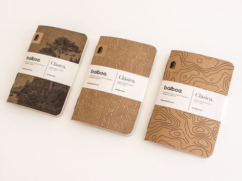 These notebooks have a great natural theme with topographic map information, linear wood grain and an image of nature. Wood Packaging Design, Notebook Packaging Ideas, Wood Graphic Design, Grain Packaging, Nature Notebook, Notebook Mockup, Wood Packaging, Creative Notebooks, Business Stationary