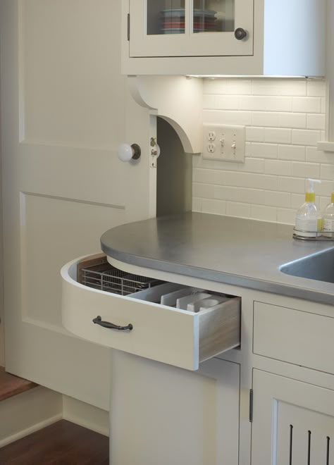 In this kitchen, a curved drawer and base cabinet maximizes storage while easing out of the traffic flow between a back stairway and the kitchen sink. Curved Kitchen Cabinets, Curved Drawer, Corner Drawers, Curved Cabinets, Curved Kitchen, Modular Kitchen Cabinets, Corner Kitchen Cabinet, Kitchen Base Cabinets, Diy Kitchen Storage