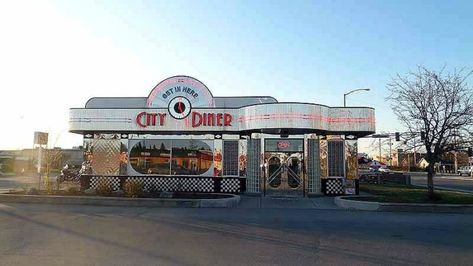 City Diner is located in Anchorage. Its shiny exterior is hard to miss and three simple words on the sign, "GET IN HERE," tell you exactly what to do. Vintage Diner Exterior, 1950s Diner Exterior, 90s Diner Exterior, 60s Diner Exterior, 50s Diner Exterior, Diner Exterior Design, Bloxburg Diner Exterior, American Diner Exterior, Sims Strangerville