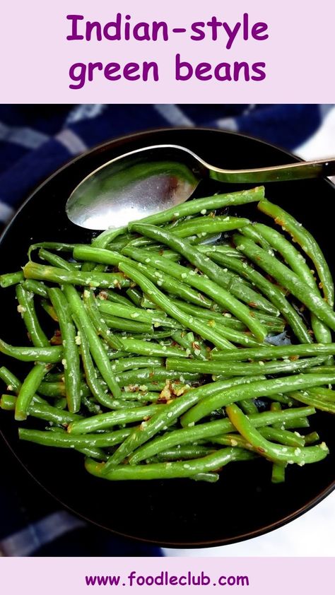 Indian-style green beans in a black serving dish with a large serving spoon. Curry Green Beans Recipe, Green Beans Vegan Recipe, Indian Style Green Beans, Green Bean Indian Recipes, Side Dishes For Indian Food, Green Beans Indian Recipe, Green Bean Curry Recipes, Indian Green Beans Recipe, Beans Recipe Indian Green