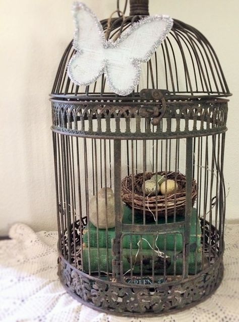 It is easy to find inspired ways to display birds in your home. Gather any bird related items and display them together. How To Decorate Bird Cages, How To Decorate An Old Birdcage, Bird Cage Decor Ideas Indoor, Diy Birdcage Decor, Decorated Bird Cages Ideas, Decorative Bird Cages Ideas, Bird Cages Decorated Ideas, Repurposed Bird Cage Ideas, Birdcage Decor Ideas