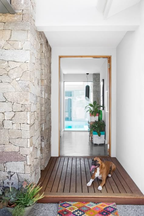 “This house feels like a sanctuary,” says owner Kristie, who opens her front door to a view straight through to the pool. Photo: Angelita Bonetti | Story: Australian House & Garden Balinese Villa, Front Door Entrance, House Front Door, Stone Cladding, Front Entrances, Australian Homes, Facade House, House Entrance, Front Garden