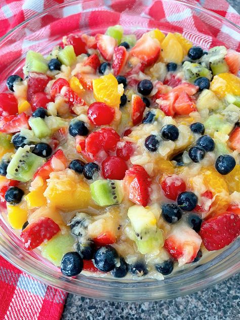 This Vanilla Glazed Fruit Salad recipe is perfect for picnics or potlucks. With a refreshing blend of fresh and canned fruits it is elevated with a luscious vanilla pudding glaze. Quick and easy to make, it's a sweet sensation that will dazzle your taste buds! Fruit Salad Using Vanilla Pudding, Fruit Pudding Salad, Fruit Salad Vanilla Pudding, Fruit Salad With Cheesecake Pudding, Recipes For Fruit Salad, Fruit Salad With Pudding Mix Vanilla, Small Fruit Salad, Fruit Salad From Frozen Fruit, Brunch Fruit Salad Recipes