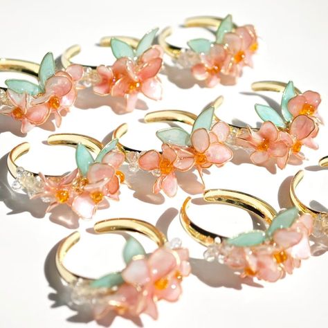 This is a handmade ring with sakura as the main theme. Each ring is unique, ensuring that each piece has high quality and exquisite details. This ring can be used not only for special occasions, but also for daily wear, allowing you to showcase your unique charm. Size:Adjustable ring Notice: There may be differences in color due to different monitors. Since it's 100% handmade customized product, we do not accept returns or exchanges. If any damage occurs during transportation, please take a photo of the damaged goods and send it to the me. I will remake and resend it for free. I accept customization and color changes. Please contact me before placing your order to note the color you want or send me a picture of the style you want to customize. Thank you for your interest in my store,Have a Sakura Ring, Petal Ring, Pearl Wedding Ring, Wire Projects, Accessories Pearl, Fairy Ring, Bouquet Gift, Main Theme, Flower Jewelry