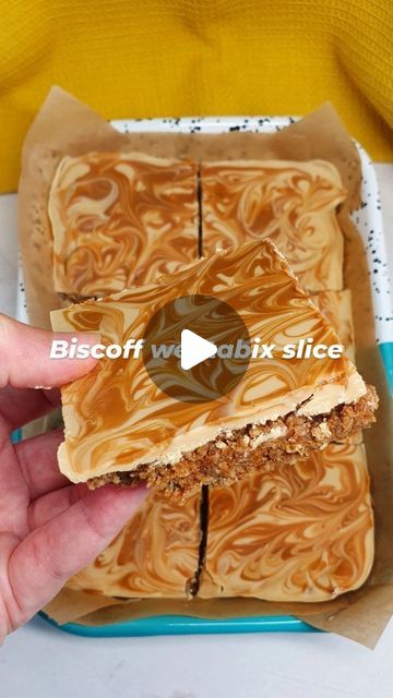 Emily Scott on Instagram: "BISCOFF WEETABIX SLICE 🧡. This no-bake Biscoff weetabix slice is so delicious and easy to prepare.

Simply mix melted Biscoff spread with crumbled weetabix and Greek yoghurt and press into a dish, then top with melted white chocolate and a Biscoff swirl 😍.

More of a snack than a breakfast, it'll keep in the fridge for up to 3 days (if it lasts that long 😋).

Recipe (makes 6 servings):
🧡 Melt 100g Biscoff spread in a large bowl for 30 seconds in the microwave.
🧡 Crumble 8 weetabix and add to the bowl along with 175g Greek yoghurt. Mix until combined.
🧡 Press the mixture into a lined, medium sized dish or tin.
🧡 Melt 100g white chocolate with 1 tsp Biscoff spread for 30 secs in the microwave, then spoon over the weetabix and spread in an even layer. Swirl s Weetabix Slice, Weetabix Recipes, Melted White Chocolate, Emily Scott, Biscoff Spread, So Delicious, Large Bowl, 30 Seconds, No Bake