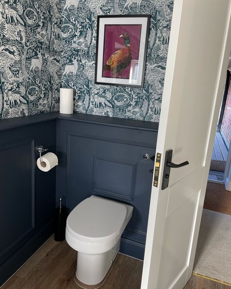 Bathroom Wallpaper & panelling inspo. Follow for more ideas #wallpaper #panelling #downstairsloo #bathroom #interiordesign #interiordesignideas Blue Cloakroom Toilet Ideas, Panelled Powder Room, Wallpapered Cloakroom Downstairs Loo, Bathroom Door Panelling, Navy Downstairs Toilet Ideas, Panelled Wc Ideas, Wc Ideas Downstairs Loo Panelling, Downstairs Toilet Ideas Navy, Wallpaper And Panelling Bathroom