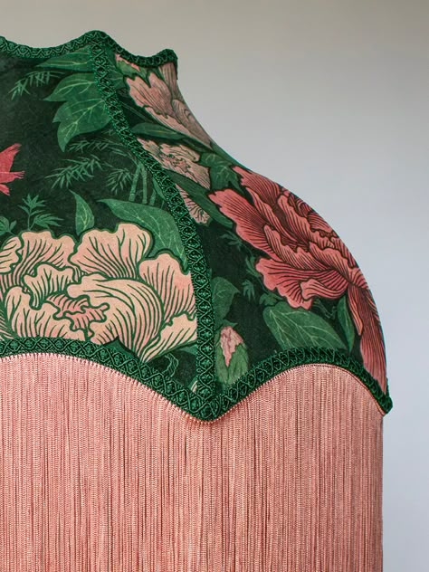 A handmade velvet lampshade in blush pink, soft rose and green, finished with ornate braiding and fringe. Bring your room into bloom with a print designed to delight – Bloomin’ Marvellous! Inspired by one of our favourite London spaces, the beautiful St James’s Park, our Bloomin’ Marvellous print features expansive blooms of trailing peonies. Set against the bucolic backdrop of the park’s Dutch Cottage, they are joined by the resident royal pelicans to create a whimsical wonderland that’s big on Lampshades Bedroom, Velvet Chandelier, Festival Activations, Scalloped Lampshade, Dutch Cottage, Lampshades Ideas, Fringe Lampshade, Velvet Lampshade, Vintage Lampshades