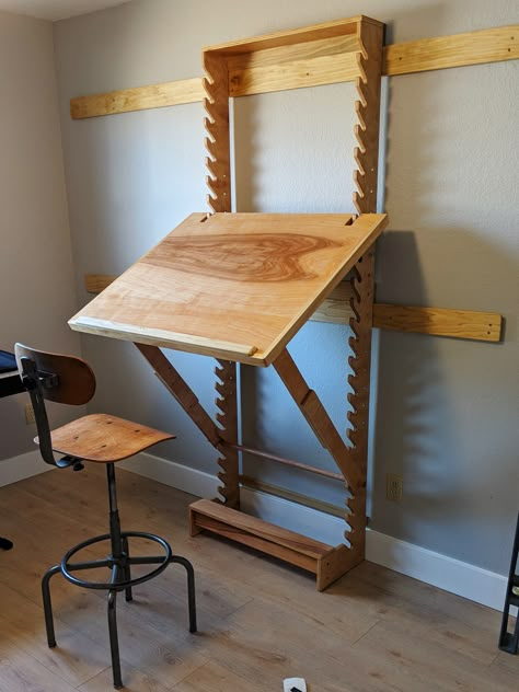 I built a desk for doing my artwork. It’s adjustable so I can use it as a standing or sitting desk and lay it flat or angled. I took design cues from a bunch of different desk images I found online, but I mainly copied Nathan Frey’s Frey Desk. Workroom Organization Ideas, Wall Drafting Table, Folding Art Table, Standing Drafting Table, Art Studio Diy Ideas, Diy Work Table Art Studios, Ikea Drafting Table Hack, Adjustable Drafting Table, Adjustsble Desk