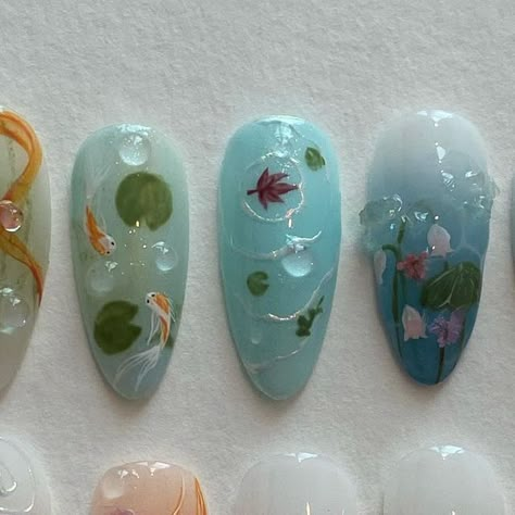 press on nails • nail design art on Instagram: "custom set ; koi pond" Coy Fish Nail Art, Lily Pad Nail Art, Water Lily Nail Art, Nails With Fish Design, Pond Nail Art, Koi Nails Designs, Koi Fish Nail Design, Fish Themed Nails, Koi Nail Art