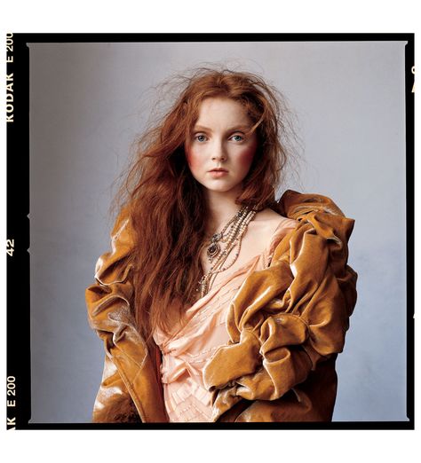 IRVING PENN again, his photos are similar to horst's in a lot of ways with his back and white photographs containing a sense of mystery and elegance.  i enjoy this image in colour because of the muted cool undertones tones that are contradicted by warmer clothing and hair colour Lilly Cole, Germanic Paganism, Shades Of Red Hair, Lily Cole, Irving Penn, Mario Sorrenti, Tim Walker, Vogue Us, Hair Shades