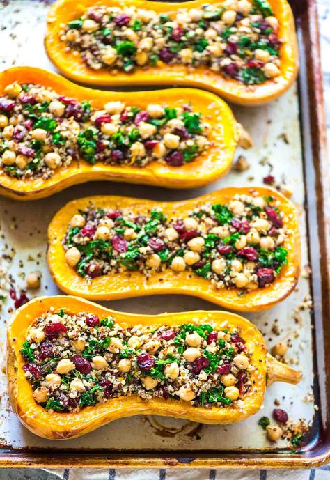 Delicious, healthy Quinoa Stuffed Butternut Squash with Cranberries, Kale, and Chickpeas. An easy, satisfying, vegetarian side dish recipe that’s perfect for fall! Kale And Chickpeas, Vegetarian Side Dish Recipes, Stuffed Butternut Squash, Stuffed Butternut, Chickpeas Recipe, Quinoa Kale, Stuffed Squash, Vegan Easter, Healthy Thanksgiving Recipes