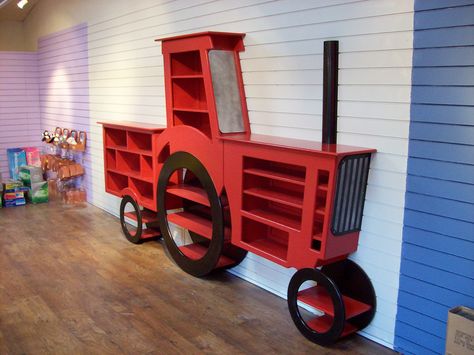 Bespoke tractor shelving unit for display in a farm park shop. Tractor Display Ideas, Farm Market Ideas, Toy Barn, Toy Shelves, Market Ideas, Toy Display, Farm Market, Tractor Trailers, Tiny Humans