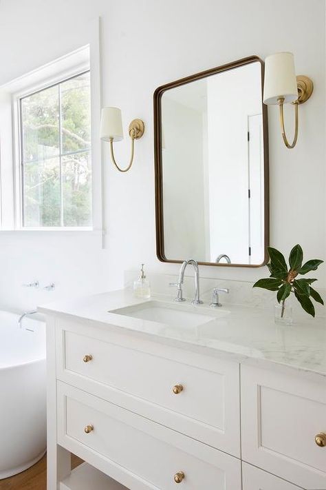 Satin Nickel And Brass Bathroom, White Vanity Brass Hardware, White Vanities With Gold Hardware, Powder Bathroom White Vanity, Brass Chrome Bathroom, Chrome And Brushed Brass Bathroom, Light Blue And Brass Bathroom, White Bathroom With Brass Fixtures, Polished Chrome And Brass Bathroom