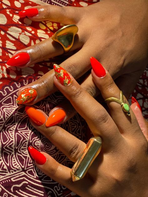 Orange And Gold Foil Nails, Orange Nails With Gold Flakes, Red And Orange Nails Design, Orange Foil Nails, Red And Gold Foil Nails, Orange And Gold Nails Acrylic, Carnelian Nails, Orange Red Nails Design, Reddish Orange Nails