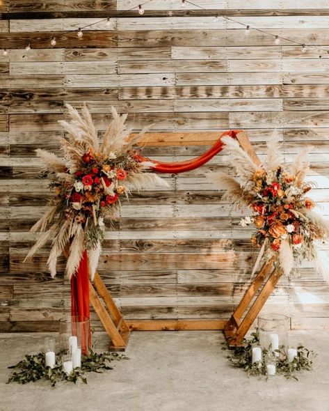 Florist: Thistle & Vine (Ider, AL) Venue: The Venue at Lily Lou’s (Trenton, GA) . #pampas #boho #arbor #bohoarbor #pampasarbor #hexagonarbor #hexagon #wild #wedding #weddingarbor #weddinginspiration #weddingflowers #weddingflorist #natural Rust Boho Wedding Flowers, Terracotta Arbor Wedding, Hexagon Wedding Arch Flowers Fall, Boho Fall Wedding Arbor, Boho Wedding Hexagon Arch, Burnt Orange Wedding Alter, Hexagon Wedding Arch Terracotta, Hexagon Arch Fall Wedding, Hexagon Wedding Arch Flowers Boho