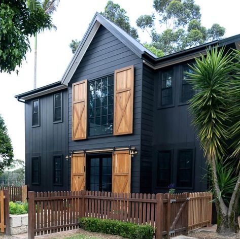 Pairing a black exterior with natural cedar wood shutters provides a great contrast to this dark modern farmhouse. Plus the sliding barn doors on the first floor are amazing! via The Essential Detail. #downleahslane #blackhouse #darkhouse #blackexterior #blackhouse #cedarshutters #slidingbarndoors #cedar #modernfarmhouse #twostoryhouse #dreamhouse Black Brick House, Shutter Colors, Cedar Shutters, Black Houses, Cedar Homes, Dark House, Siding Colors, Black Brick, Architecture Model Making