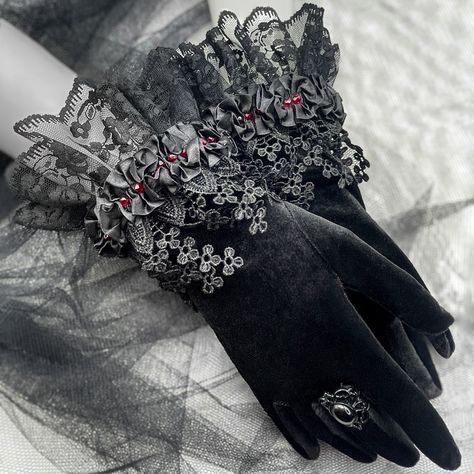 Elevate your style with my Black Velvet Gothic Victorian Short Gloves featuring Lace Accents and delicate beads. Meticulously designed for a touch of dark romance, these gloves, crafted from luxurious black velvet, exude sophistication. The intricate lace accents, adorned with subtle beads, add a graceful charm, capturing the essence of Victorian elegance. Perfect for those who appreciate unique accessories, these gloves are an exquisite addition to your wardrobe. Make a statement with a blend of gothic allure and refined style. Embrace the mystique and adorn your hands with these beautifully crafted gloves. Glove size - one size , fits approximately up to 17 cm/ 6.69 inches of wrist circumference. GALIS JEWELRY DESIGNS Visit my shop homepage here: https://www.etsy.com/shop/GalisJewelryDes Black Gloves Aesthetic, Luxury Goth, Goth Gloves, Gloves Ideas, Gothic Gloves, Victorian Gloves, Steampunk Gloves, Gloves Aesthetic, Fancy Gloves