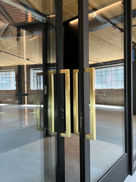 Glass storefront doors with satin brass mitered handles. San Francisco, CA. Exterior Double Front Doors, Door Gym, Storefront Glass, Storefront Doors, Shop Doors, Double Front Doors, Brass Door Handles, Glass Front Door, Iron Gate