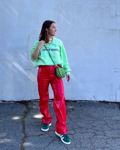 🍉🍒🍓 For a bold, elevated street style outfit that's comfortable and makes a statement, here's a suggestion: 1. Top: Neon green oversized graphic sweatshirt for a vibrant, eye-catching look. 2. Bottom: Faux red leather pants to add texture and a pop of color. 3. Footwear: Chunky sneakers for comfort and to balance the bold colors. 4. Accessories: - Statement sunglasses, perhaps with mirrored or colored lenses. - A crossbody bag in a complimentary color, like light or dark green. - Simple, ... Neon Green And Red Outfit, Elevated Street Style, Red Leather Pants, Statement Sunglasses, Street Style Outfits Men, Complimentary Colors, Green Outfit, Outfits Men, Chunky Sneakers