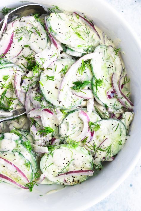 This Creamy Vegan Cucumber Salad with Dill and Red Onion is filled with delicious fresh cucumbers, savory herbs and spices, and a bright squeeze of lemon! Enjoy it as a side dish or as a light and tasty lunch. Cucumber Salad Sour Cream, German Cucumber Salad, Cucumber Dill Salad, Creamed Cucumbers, Dill Dressing, Fresh Summer Salad, Cucumber Dill, Creamy Cucumber Salad, Resep Salad