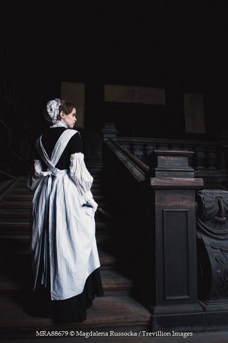 Magdalena Russocka VICTORIAN MAID CLIMBING SPOOKY GRAND STAIRCASE Women Victorian Maid Aesthetic, Victorian Servant Aesthetic, Victorian Servants Dress, Whitepine Aesthetic, Fantasy Priestess, Maid Aesthetic, Victorian Servants, Servant Clothes, Riding Habit Victorian