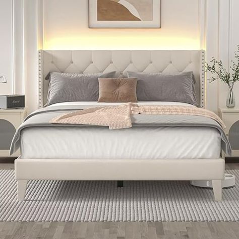 Want to update your bed? Take a look at this wingback diamond embellished tufted queen headboard. It comes in two different colors, beige and dark gray. As you can see in the photo, I chose the beige one. It does have a$30 off coupon - click the link below to check it out! Headboard Lights, Upholstered Queen Bed Frame, Bedroom Finds, Bed Frame With Led Lights, Upholstered Full Bed, Headboard Wood, Diamond Tufted Headboard, Queen Size Bed Frame, Grey Bed Frame